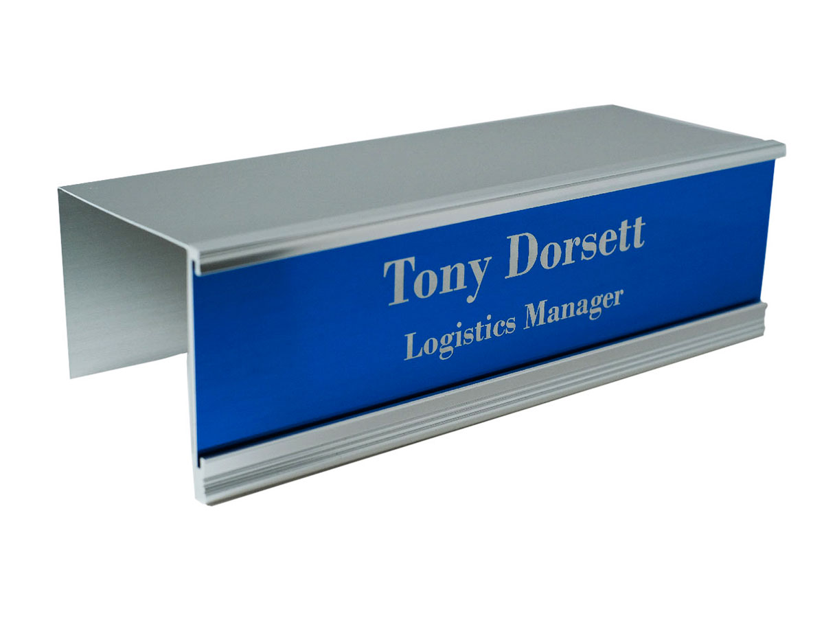 Cubicle name plate holders for offices easily slide over any cubicle wall and move anywhere without damaging the fabric wall. Many sizes, colors and options. NapNameplates.com